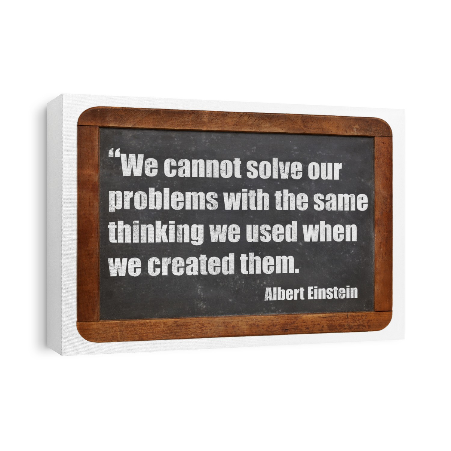 We cannot solve our problems with the same thinking we used when we created them  - a quote from Albert Einstein - white chalk text  on a vintage slate blackboard